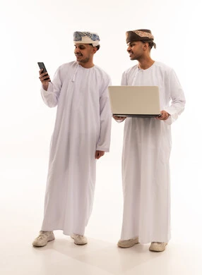 Omani Men Using Laptop and Smartphone on White Background