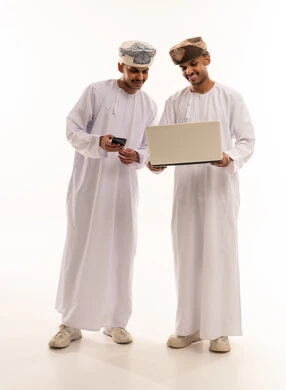 Omani Men Using Laptop and Smartphone on White Background