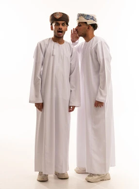 Omani Men Whispering Secret with Shocked Expression