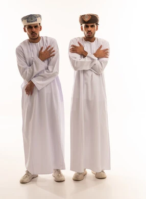 Omani Men in Traditional Dress Feeling Cold