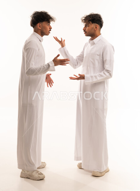 Two Saudi Men in White Thobes Arguing in Studio