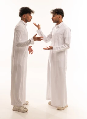 Two Saudi Men in White Thobes Arguing in Studio