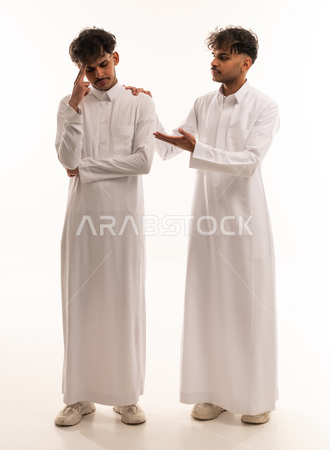 Saudi Men in Thobes Supporting Friend White Background