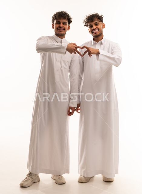 Saudi Men in Thobes Making Heart Gesture