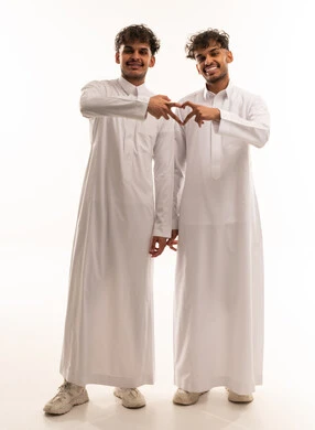 Saudi Men in Thobes Making Heart Gesture