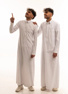 Two Saudi Men in Traditional Thobes Pointing Up