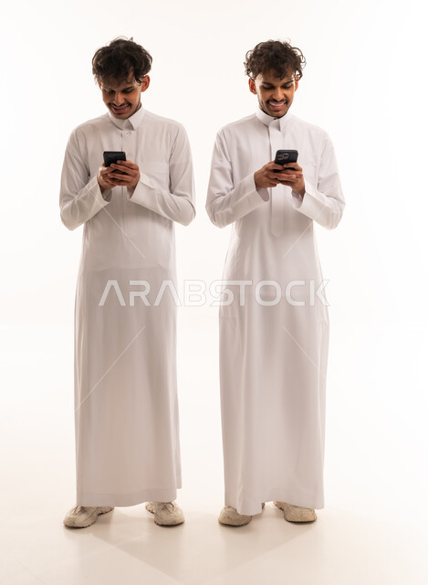 Saudi Men in Thobes Using Smartphones on White Background