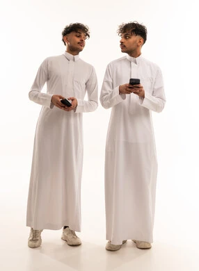 Saudi Men in Thobes Using Smartphones in Studio