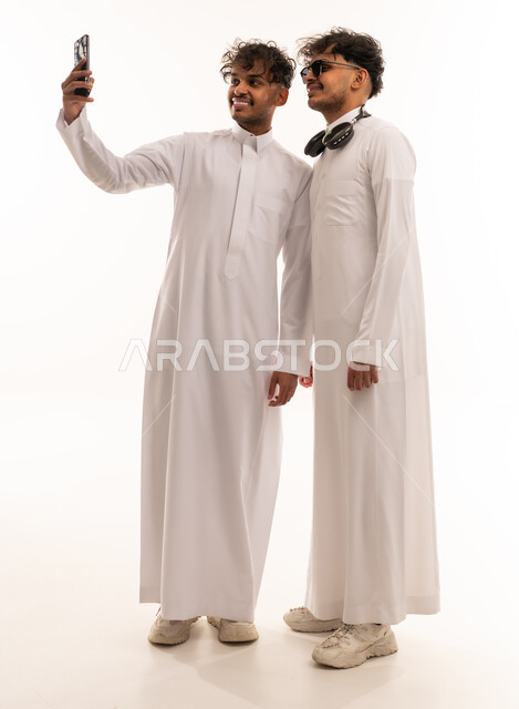 Saudi Men in Thobes Taking a Selfie in Studio