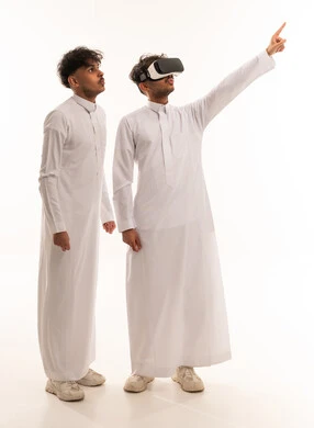 Saudi Men in Thobes Using VR Headset on White Background