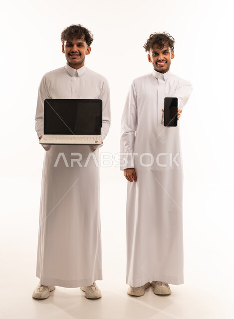 Saudi Men in Thobes Holding Laptop and Smartphone