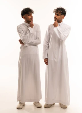 Two Saudi Men in Traditional Thobe Thinking Pose