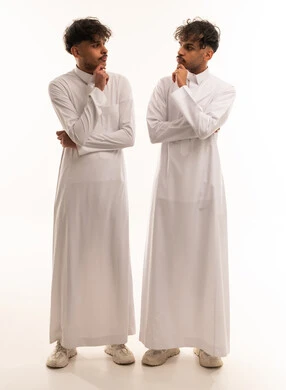 Saudi Men in Traditional Thobes Thinking in Studio