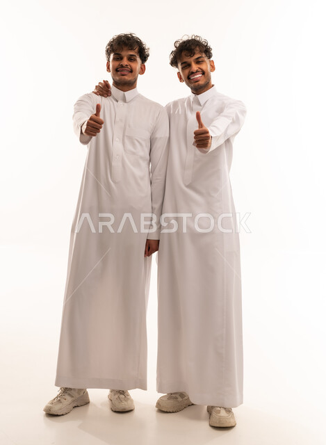Saudi Men in Traditional Thobe Giving Thumbs Up