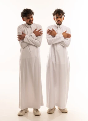 Saudi Men in White Thobes Shivering from Cold