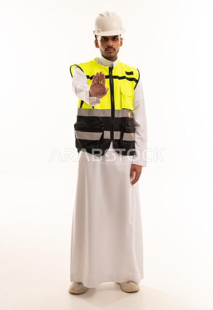 Saudi Engineer in Safety Vest Making Stop Gesture