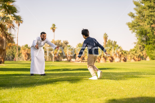 Saudi Father and Son Playing in Public Park