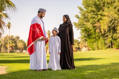 Omani Family with National Flag in Public Park