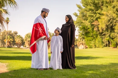 Omani Family with National Flag in Park