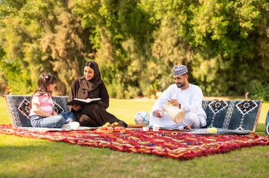 Omani Family Picnic in Park with Traditional Coffee Omani Family Picnic in Park with Traditional Coffee