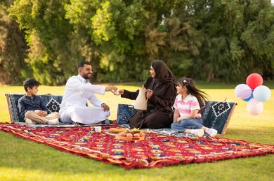 Saudi Family Picnic in Green Park with Coffee