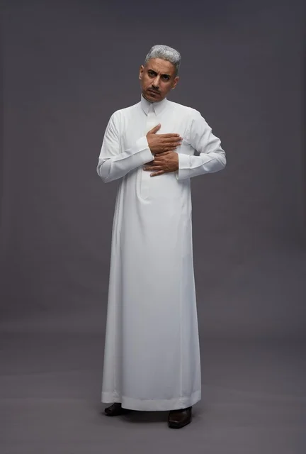 Saudi Man in White Thobe with Hand on Heart Portrait