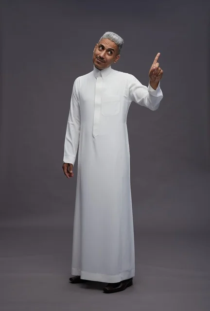 Saudi Man in Traditional Thobe Pointing Upward