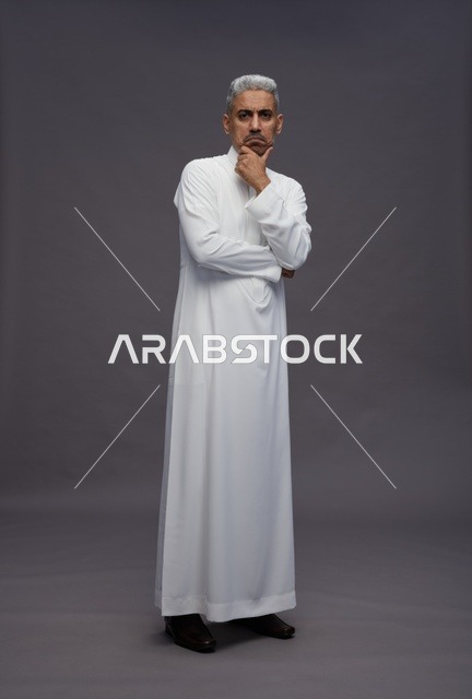 Saudi Man in White Thobe Thinking on Grey Background
