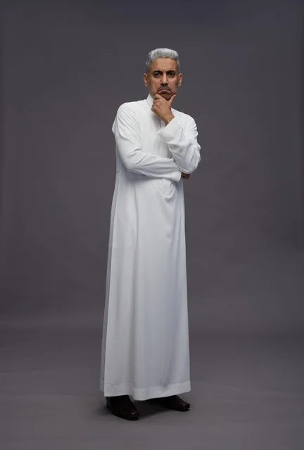 Saudi Man in White Thobe Thinking on Grey Background