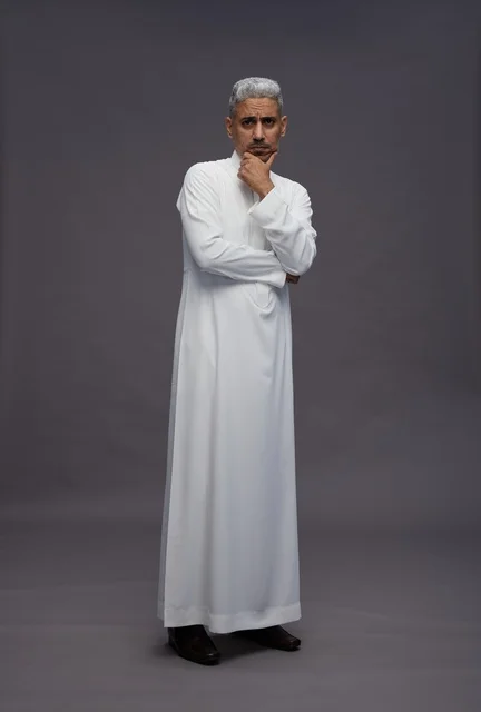 Saudi Man in White Thobe Thinking on Grey Background