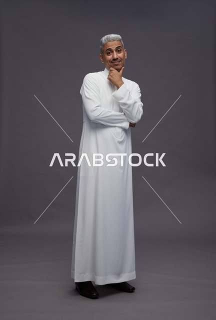 Saudi Man in Traditional Thobe Thinking in Studio