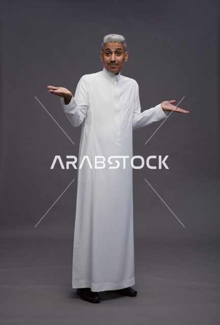 Saudi Man Shrugging in White Thobe on Grey Background