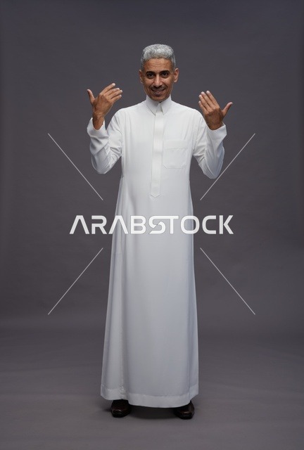 Saudi Man in White Thobe on Grey Background