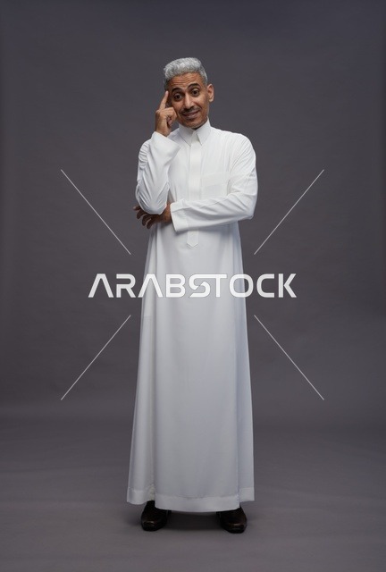 Saudi Man in White Thobe Thinking on Grey Background