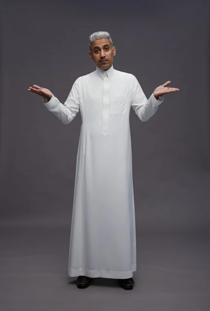 Saudi Man Shrugging in White Thobe on Grey Background