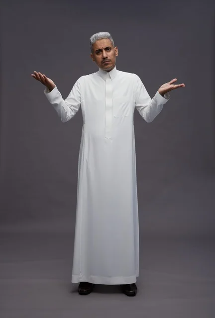 Saudi Man in White Thobe Shrugging on Gray Background