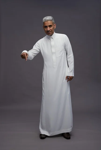 Saudi Man in White Thobe Pointing Down on Gray