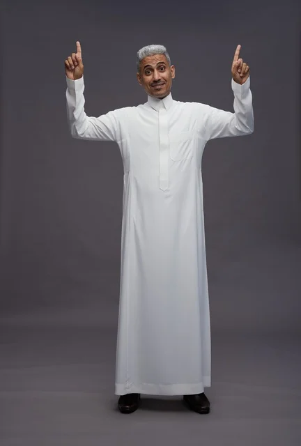 Saudi Man in White Thobe Pointing Upwards