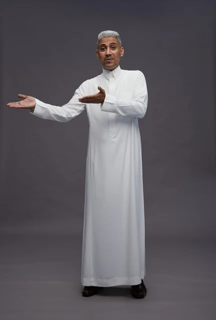 Saudi Man in White Thobe Gesturing on Grey Background