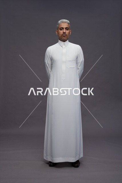 Saudi Man in White Thobe on Grey Background