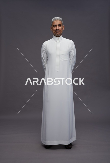 Mature Saudi Man in Traditional White Thobe Studio Shot