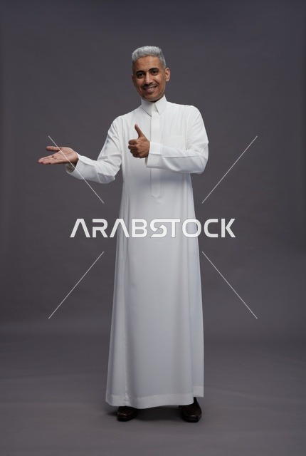 Saudi Man in White Thobe Giving Thumbs Up