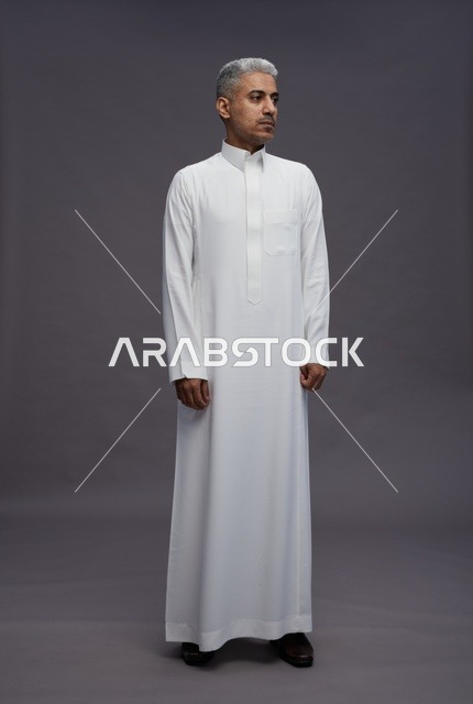 Saudi Man in White Thobe on Grey Background