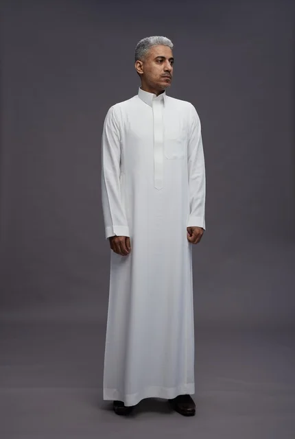 Saudi Man in White Thobe on Grey Background