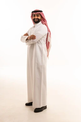 Smiling Saudi Man in Traditional Thobe and Shemagh