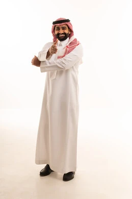 Saudi Man in Traditional Thobe Making Hand Gesture