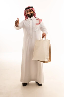 Saudi Man with Shopping Bags and Thumbs Up Sign