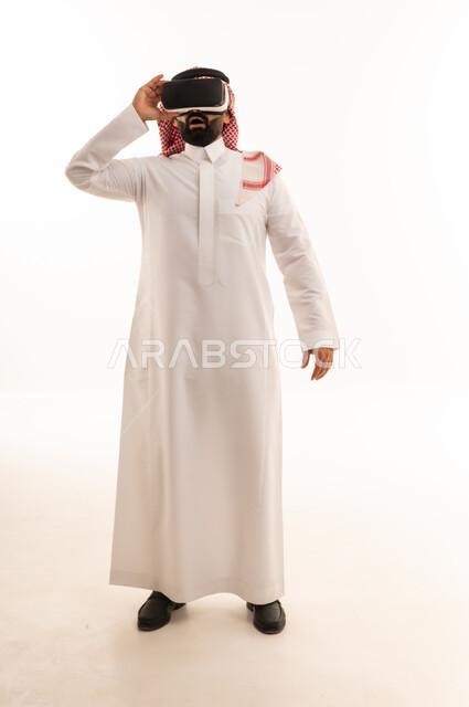 Saudi Man Using Virtual Reality Headset on White Background