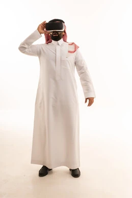 Saudi Man Using Virtual Reality Headset on White Background