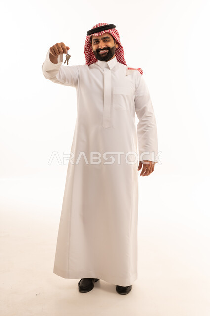 Saudi Man in Thobe Holding Keys on White Background